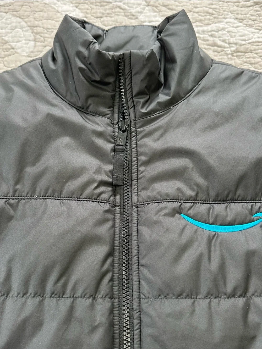 The North Face Black Puffer Vest with Amazon Logo
